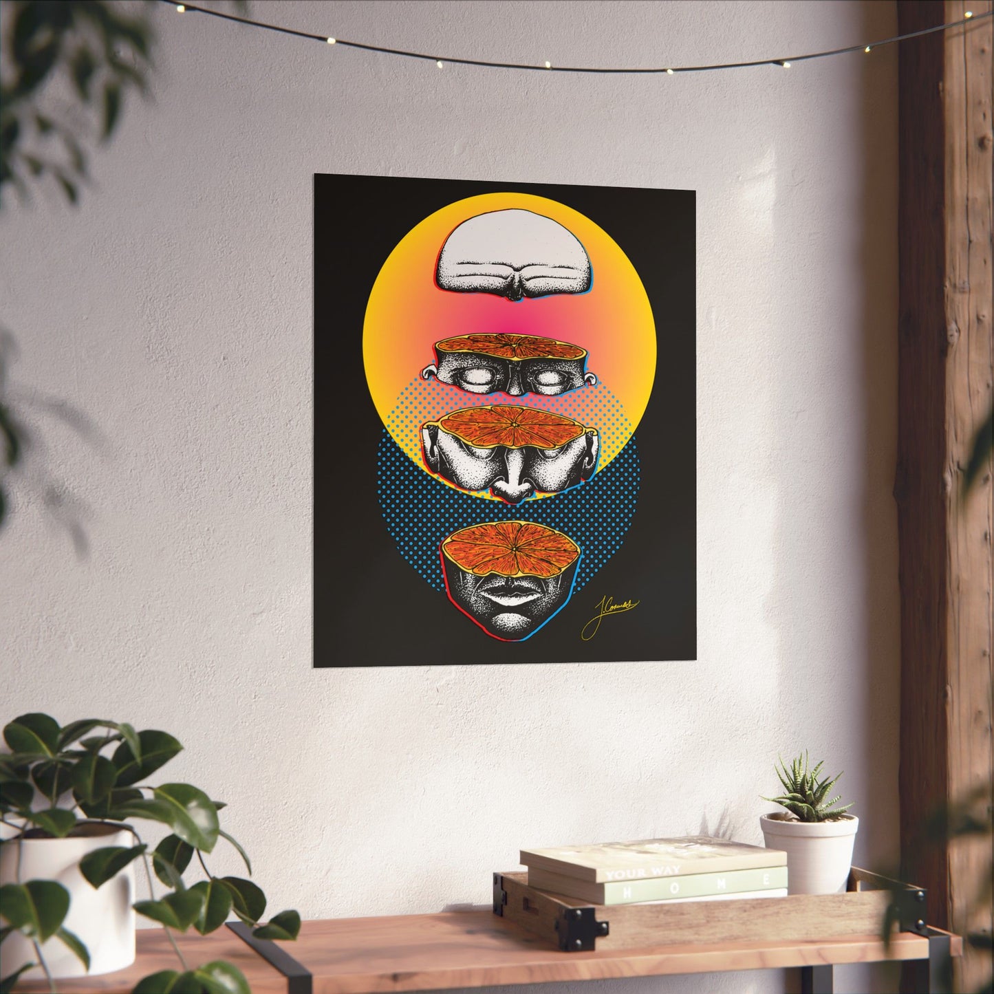 Surreal pen-and-ink art print with abstract figure by Coomes Creative. Hung up example of a colorful print depicting man's head surrealistically separated into four pieces, exposing juicy fruit like flesh filling the man's head. Set on black, yellow, pink and blue background with anaglyph effects.